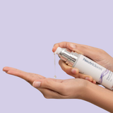 Neutriderm Copper Activator bottle with a swatch of the product being dispensed, showcasing its lightweight texture.